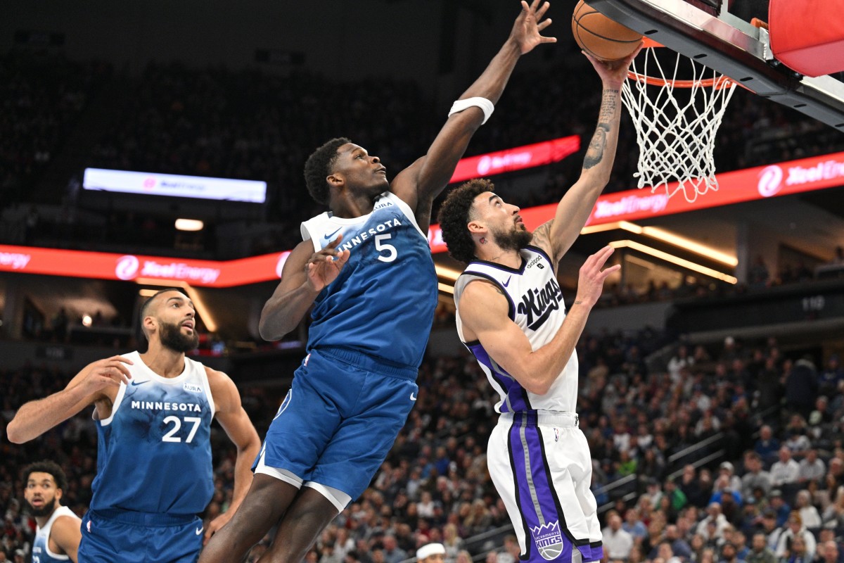 Nov 24, 2023; Minneapolis, Minnesota, USA; Minnesota Timberwolves guard Anthony Edwards (5) blocks the shot of Sacramento Kings guard Chris Duarte (3) as center Rudy